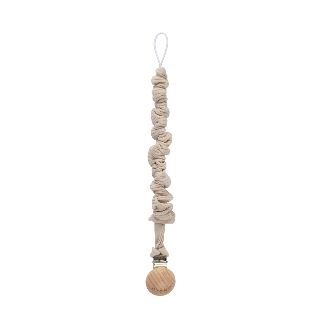 Tan solid ribbed paci clip